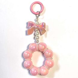 New bow and pearl string mobile phone bag accessories, key hanging round buckle, colored beads for girlfriends