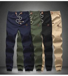 Nuovo design 2015 Fashion Drowtring Men pantaloni di alta qualità uomini pantaloni da jogger pantaloni per il tempo libero uomo M5xl size 7413541