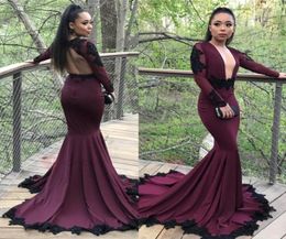 Sexy Mermaid Prom Dresses 2018 Black Appliqued Long Sleeves Plunging V Neck Black Girls African Party Gowns Evening Formal Wear7496695