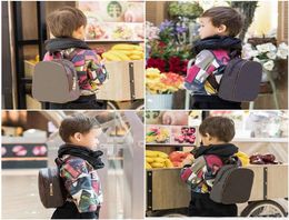 Sell Kids Backpacks Fashion High Quality PU Shoulders Bags Kindergarten Baby Boys Girls School Bag Classic Printing Book Packa8152534