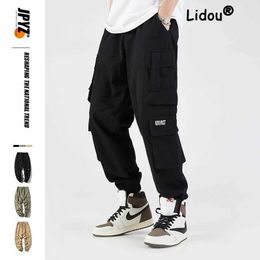 Men's Pants Street clothing black mens harem jogging pants mens goods pants 2022 hip-hop casual pocket sports pants mens oversized fashion Trouser J240507