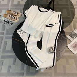 Fashionable temperament, age reducing short sleeved top, casual sports set, women's summer 2023 new white wide leg pants two-piece set