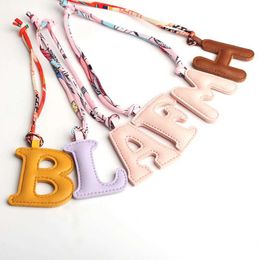 Keychains Lanyards N D R S E B L A F M H Wholesale Customized PU PVC Artificial Leather Original English Letter Keychain Pendant Womens Bag Charm J240509