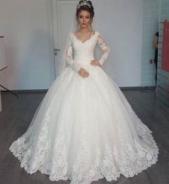 Gorgeous Sheer Ball Gown Wedding Dresses 2019 Puffy Lace Beaded Applique White Long Sleeve Arab Wedding Gowns robe de mariage1282454