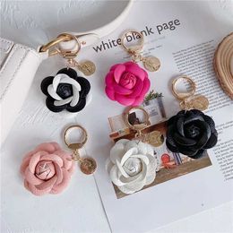 Keychains Lanyards Fashion leather camellia car keychain cute flower backpack pendant accessories personality keychain ring women J240509