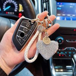 Cross -border hot sale of Pottery Mid Diamond Love Key Buckle Inlays Potano Heart Car Key Chain Ear Case Bag Trade