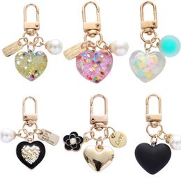 Keychains Lanyards 1 piece of keychain fashionable heart. Her keychain sparkles with a chip filled resin keychain. Womens bag pendant Valentines Day gift J240509