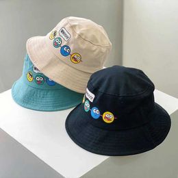 Caps Hats Childrens bucket hat new spring boy and girl sun hat cute and interesting expression outdoor childrens fishing hat Korean 2-6Y d240509