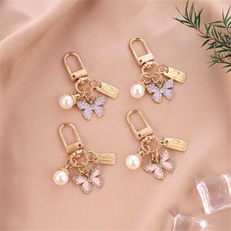 Keychains Lanyards Exquisite Rhinestone Butterfly Keychain Cute Pearl Metal Tag Keyring For Women Handbag Ornaments Charms Friend Gifts Accessories J240509