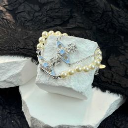 Brand High version Westwood pentagonal star drop glue Saturn bracelet with diamond surround planet new pearl Nail