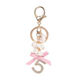 Keychains Lanyards Fashion Imitation Pearl Crystal Metal Keychain Car Key Ring Bag Accessories Bow Keyring Women Exquisite Jewelry Valentine Gift J240509
