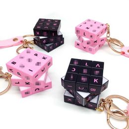 Keychains Lanyards Cute black and pink mini Rubiks cube keychain pendant wholesale cartoon book bag pendant small Jewellery keychain J240509