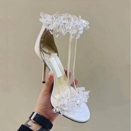 Designer lussuoso estate di ghiaccio cristallo alto tacchi fata una linea con tacchi sottili scarpe da sposa bianca scarpe acqua diamanta sandali