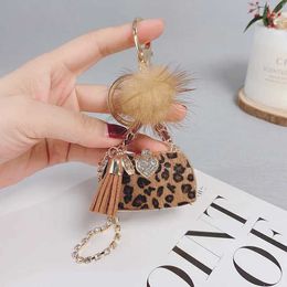 Keychains Lanyards Autumn and winter creative Leopard horse fur key chain female accessories personalized plush bag pendant key chain generation. J240509