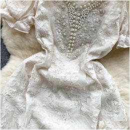 Grundlegende lässige Kleider französische Promi-Perlen-A-Line-Kleid für Frauen Sommer Neue N-Neck Kurzarm Schrumpfung Party Elegant Vestido Fe Dhwd7