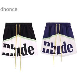 2024 Trend Designer Summer Fashion Trends International New Rhude Brand Letter Printing Casual Shorts for Mens Loose Wide Leg Mesh Pants