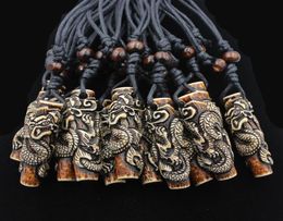 Lots Whole 12pcs COOL Boy men039s Simulation Bone Carving Totem Dragon Pendant Wood Beads Amulet Pendant Necklace Lucky Gif7946864