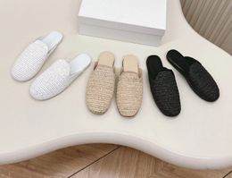 Spring and summer new laffia woven baotou flat shoes Muller shoes half drag female fashion casual all wear leather single shoes tide