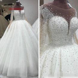 2022 Luxurious Beaded Crystal Wedding Dresses Princess With Illusion Long Sleeves White Tulle Sheer Neckline Hollow Back Ball Gown Vest 227G