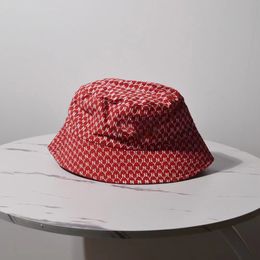 Couture denim, monogrammed, reversible fisherman's hat
