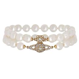 Designer Westwood Double layered Pearl Saturn Magnetic Buckle Bracelet Womens Classic Full Diamond Planet Nail With logo