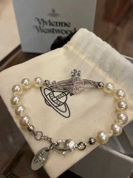 Brand Tiktok Hot Sale Westwood Pearl Pink Diamond Saturn Bracelet Fashion High end Handwear Nail