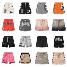 Shorts 2024 New Summer Childrens Shorts Graffiti Printing Boys Low Color Girls Pants Childrens Cute Casual Shorts d240510