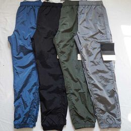 Pantaloni dei designer di marchi Stone Metal Pocket Nylon Distintivo ricamato Pantaloni casuali Isola riflettente pantaloni dimensioni M-2xl