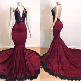 2019 Sexy Backless Burgundy Mermaid Long Prom Dresses with Black Lace Appliqued Formal Evening Gowns Halter Deep V Neck Sequins 194m