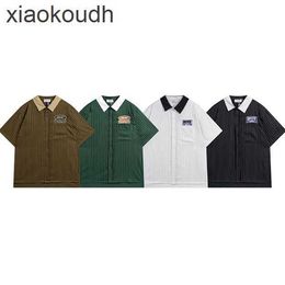 Rhude High end designer clothes for 2024 Meichao New Spring/Summer Vertical Stripe Polo Shirt Embroidered Letter Pocket Short sleeved T-shirt With 1:1 original labels