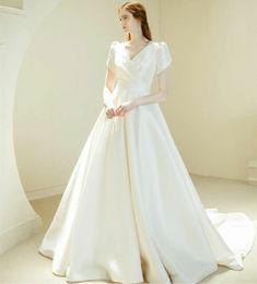 Elegant Long V-Neck Satin Wedding Dresses with Pockets A-Line Cape Sleeve Sweep Train Zipper Back Simple Bridal Gowns with Pleats for Women