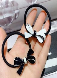 Fashion black and white acrylic bow rubber band hair tie head rope hairpins popular headwear Jewellery in European and American coun3983492