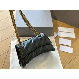 Designer Paris Hourglass Has Powerful Aura Practical Handbag. the Bag is Made Soft Calf Leather with Ing and A Metal Chain Size of 25CM