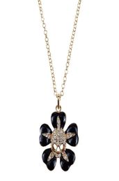 Black small flower inlaid with gold skull Saturn necklace Lacquered skull flower necklace1102549