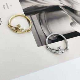 Designer Westwoods punk style is simple Personalised three-dimensional Saturns movable flat planet ring and ring. Female trend Nail