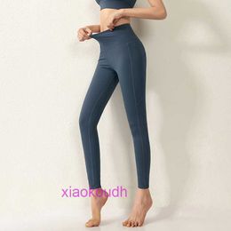 AAA designer lul comodo pantaloni da yoga sportivo femminile Nuovo High Womens Pocket Pocket Hip Sollevamento stretto Sport Sports Running Gym Net Red può essere logoro