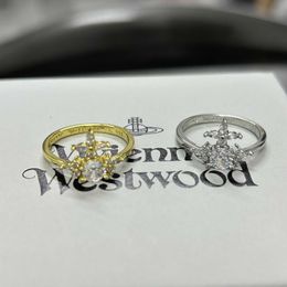 Brand SpringSummer New Westwoods Saturn Cross Ring Female Minority Design Full of Diamond Planet Nail