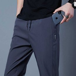 Pantaloni da uomo pantaloni da uomo 2023 business casual stretch slim fit wit elastico in vita coreano classico blu nero grigio maschio pantaloni di marca y240513