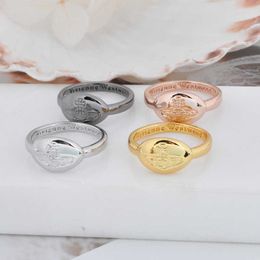 Designer Westwoods oval Saturn ring designed by same minority golden and silver personalized female Nail