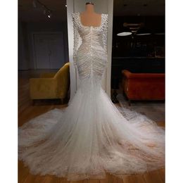 2024 Abiti da sposa sirena arabi sexy Illusione illusione Scoop Crystal perle perle per perle abiti da sposa a maniche lunghe