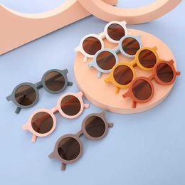 Sunglasses Childrens fashionable outdoor sunglasses round frame eye protection sunshade glasses cute candy colored for boys and girls d240513