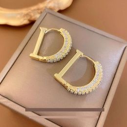 Charm designer earrings Real Gold plating Zircon letter D Earrings Fashion atmospheric Metal studs Gold buckle simple earrings female 2024