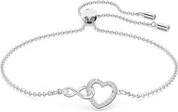 ets Swarovski Infinity heart-shaped Jewellery collection necklace and bracelet rose gold and rhodium finish transparent crystal