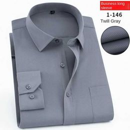 Men's Dress Shirts Mens long slved white shirts with spot embroiderybusiness and professional shirts work clothes40 cotton solid Colour shirts Y240514