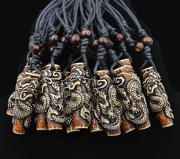 Lots Whole 12pcs COOL Boy men039s Simulation Bone Carving Totem Dragon Pendant Wood Beads Amulet Pendant Necklace Lucky Gif6219650