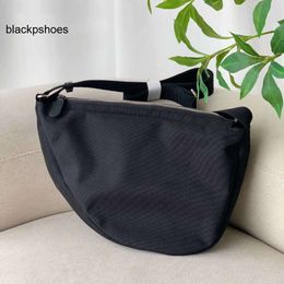 The Row TR and Japanese Korean quality Best Round Nylon Half Casual Womens Bag Small and Popular Underarm Half Moon Bag Crossbody Fashion Banana Bag for Men and Wom