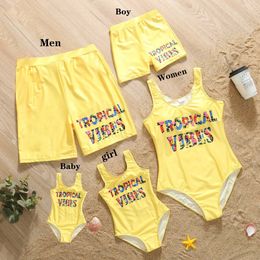 Family Matching Outfits 2024 New Family Matching Swimwear Letter Pattern Mom Daughter Skinny Bikini Beachwear One-Piece Swimsuit Dad Son Swimming Trunks T240513