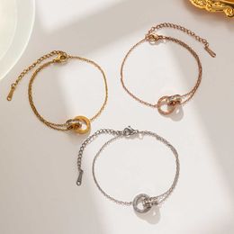 Korean diamond inlaid Roman numeral double ring buckle bracelet titanium womens titanium steel plated 18k rose gold simple temperament Bracelet