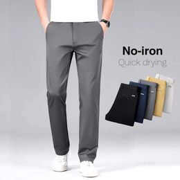 Men's Pants Classic Style Mens Cotton Elastic Casual Pants No Iron Anti-wrinkle Solid Colour Business Straight Trousers Brand Clothes Y240514