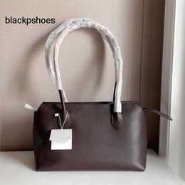 The Row TR 10aaaa Best-quality High End Top * Layer Cowhide Premium Long Handle Single Shoulder Handbag with Large Capacity Commuting Tote Bag for Women 240105